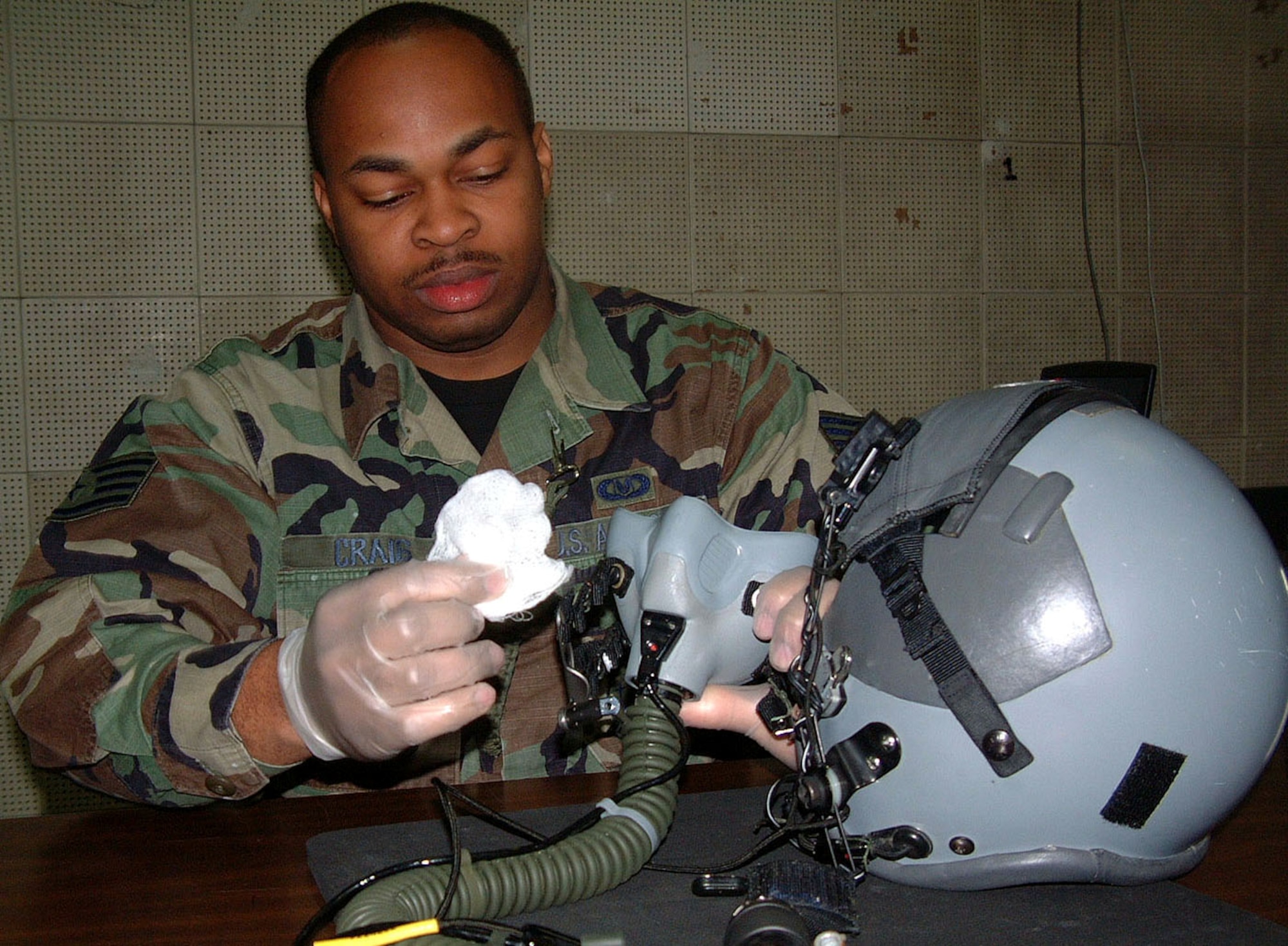 TAEGU AIR BASE, South Korea -- Staff Sgt. Christopher Craig cleans an oxygen mask.  He is deployed here from the 353rd Special Operations Group life support section at Kadena Air Base, Japan.  Life support airmen maintain all life-sustaining gear used by aircrews including chemical and biological protection suits, helmets and night-vision goggles. (U.S. Air Force photo by Master Sgt. Michael Farris)