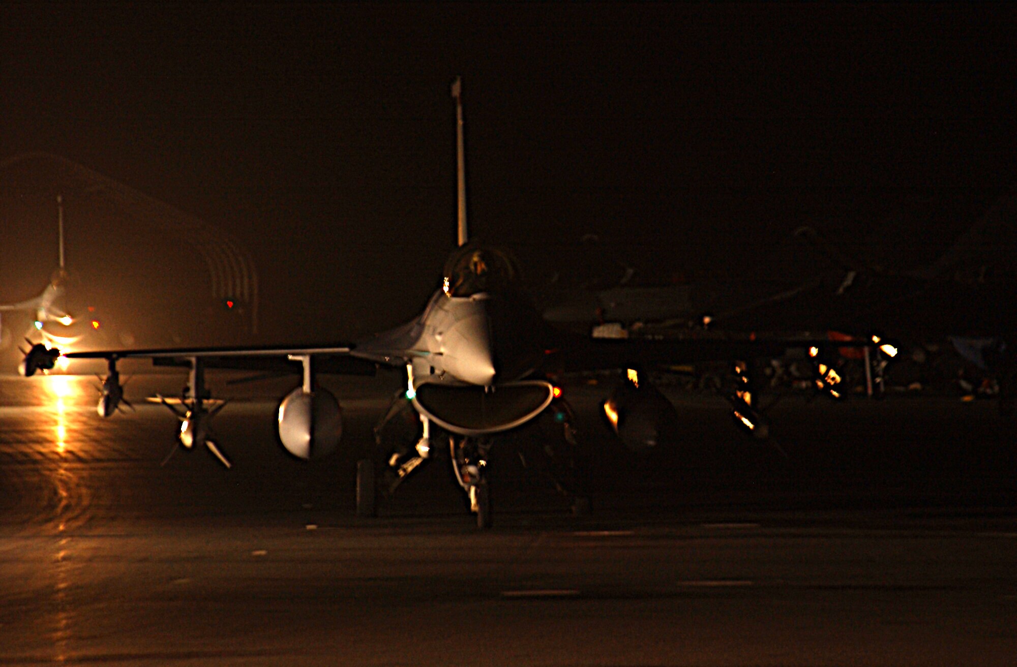 OPERATION IRAQI FREEDOM -- F-16CJ's return to a forward deployed base in Southwest Asia supporting Operation Iraqi Freedom. (U.S. Air Force photo by Master Sgt Terry L. Blevins)