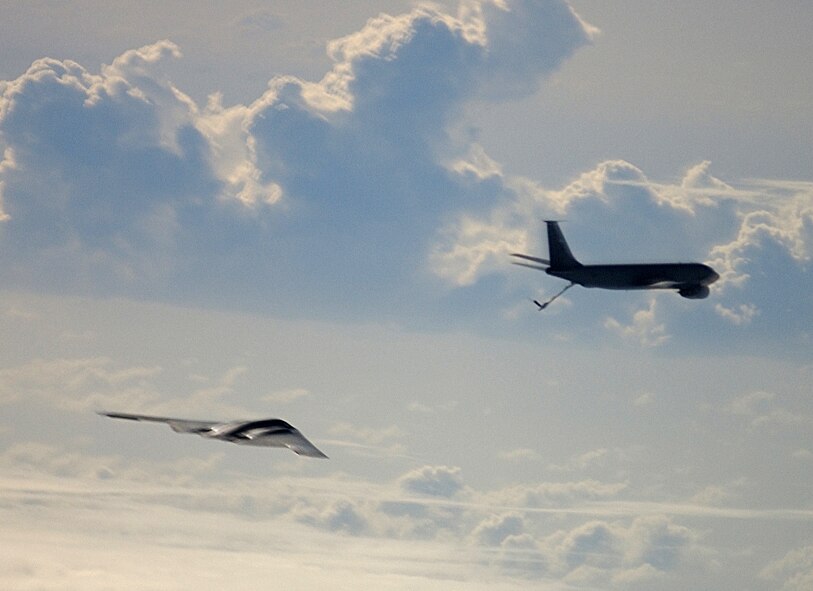 OPERATION IRAQI FREEDOM -- A KC-135 Stratotanker from the 28th Expeditionary Air Refueling Squadron prepares to refuel a B-2 Spirit bomber during A-day.  The first deployed B-2 bombers took part in the "Shock and Awe" campaign of Operation Iraqi Freedom. Coalition aircraft flew missions against more than 100 targets in Iraq in efforts to oust Saddam Hussein's regime.  (U.S. Air Force photo by Tech. Sgt. Richard Freeland) 