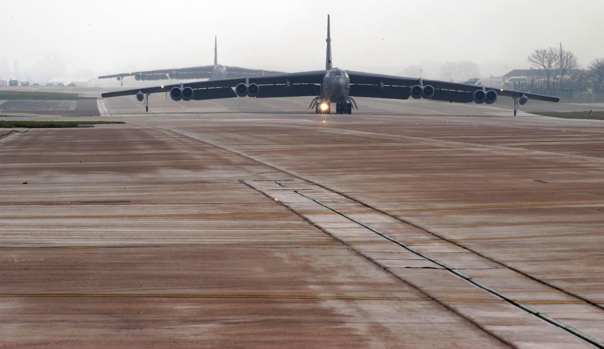 OPERATION IRAQI FREEDOM -- B-52 Stratofortress bombers taxi toward takeoff for Operation Iraqi Freedom bombing missions.  The B-52s are operating from a forward- deployed air base.  (U.S. Air Force photo by Tech. Sgt. Jason Tudor.)