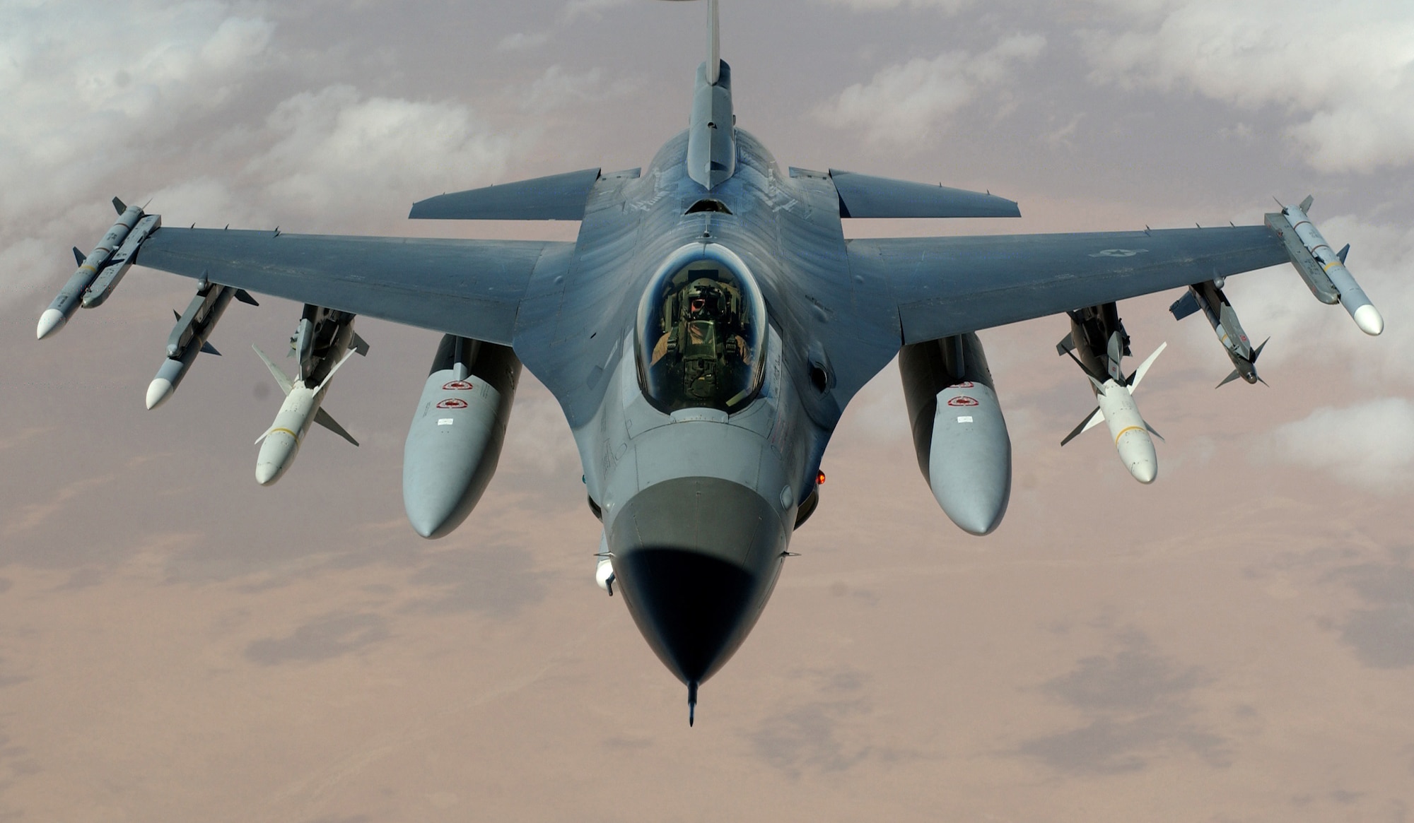 OPERATION IRAQI FREEDOM -- An F-16 Fighting Falcon flies a mission in the skies near Iraq on March 22.  The F-16s are from the 35th Fighter Wing "Wild Weasels," Misawa Air Base, Japan.  (U.S. Air Force photo by Staff Sgt. Cherie A. Thurlby)