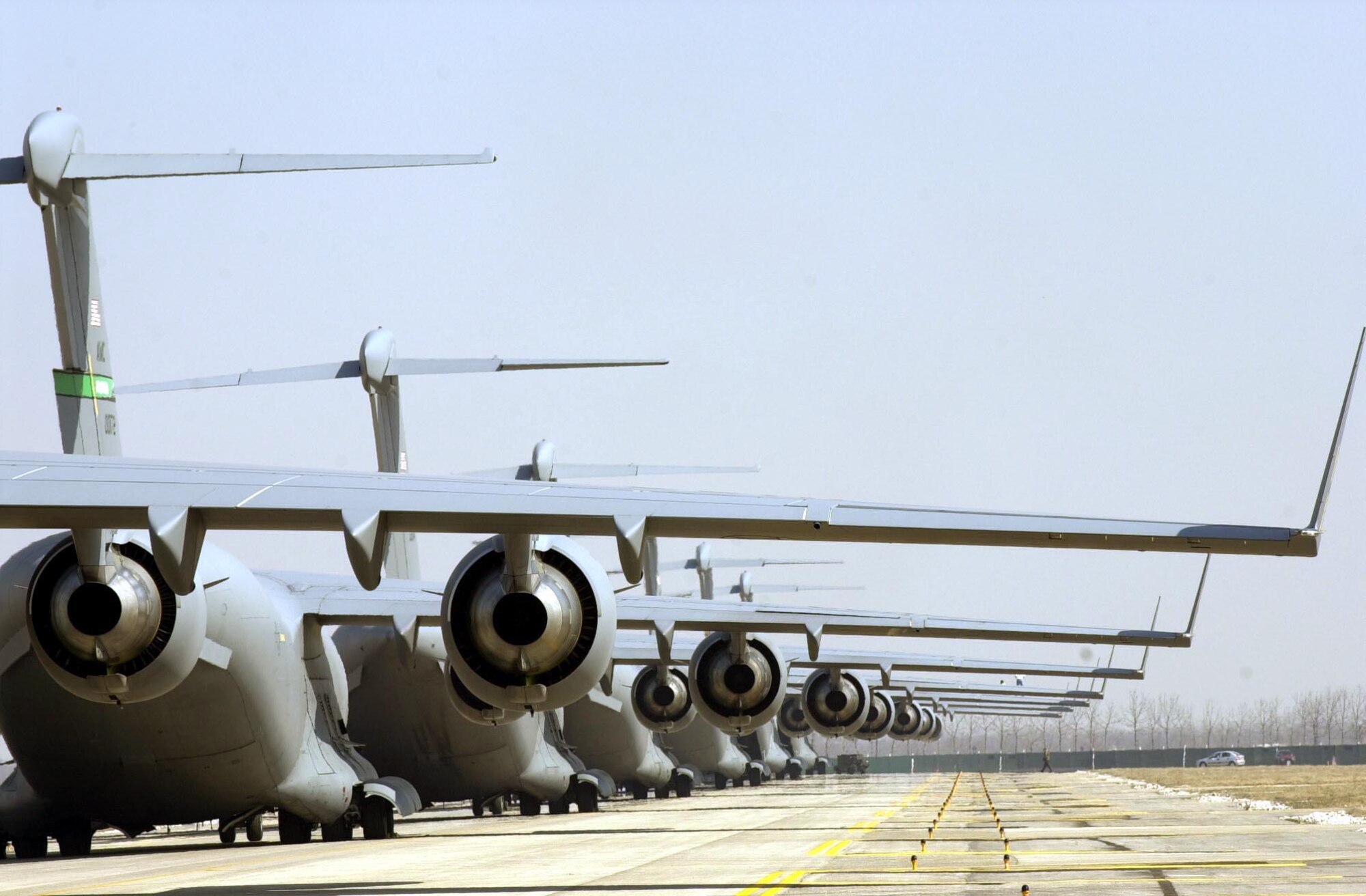 C-17 Globemaster IIIs await orders to load and launch in support of Operation Iraqi Freedom at a forward-deployed location.  (U.S. Air Force photo/Airman 1st Class Isaac G. L. Freeman) 