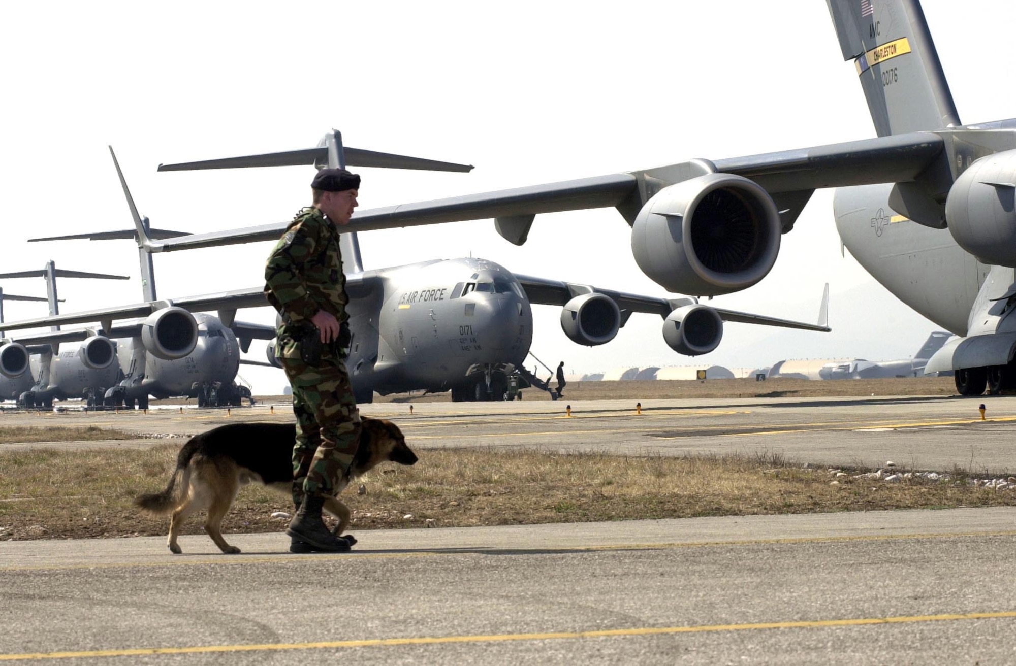 OPERATION IRAQI FREEDOM -- C-17 Globemaster IIIs await orders to load and launch in support of Operation Iraqi Freedom at a forward-deployed location.  (U.S. Air Force photo by Airman 1st Class Isaac G. L. Freeman) 