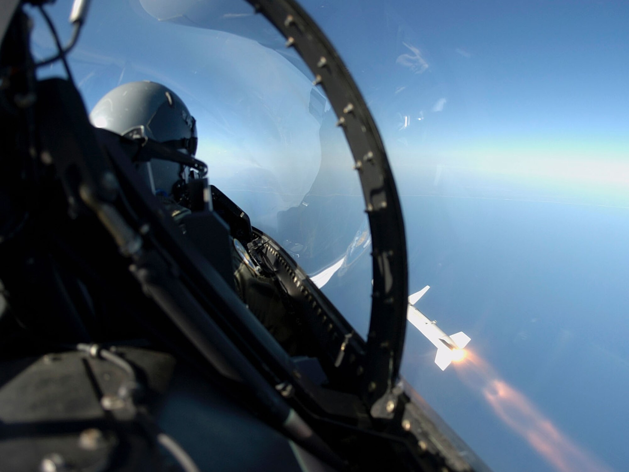 EGLIN AIR FORCE BASE, Fla. -- Maj. Matt Roberson, an F-16 Fighting Falcon pilot assigned to the 85th Test and Evaluation Squadron here, watches his AGM-88 high-speed antiradiation missile race past the cockpit after he fired it at a target during a test mission here March 24.  The HARM is an air-to-surface missile designed to seek and destroy enemy radar-equipped air defense systems.  (U.S. Air Force photo by Tech. Sgt. Michael Ammons)