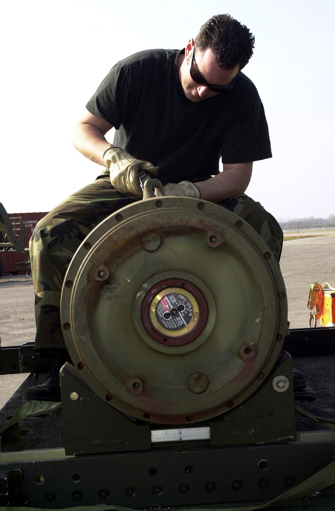 OPERATION IRAQI FREEDOM -- Staff Sgt. Matthew Duncan, 9th Munitions Squadron, Beale Air Force Base, Calif., fuses Mk 84 bombs.  Munitions troops forward-deployed build bombs before they are loaded onto B-52 Stratofortress bombers.  The base is currently home of the 457th Air Expeditionary Group which has been positioned to support Operation Iraqi Freedom. (U.S. Air Force photo by Airman 1st Class Stacia M. Willis) 