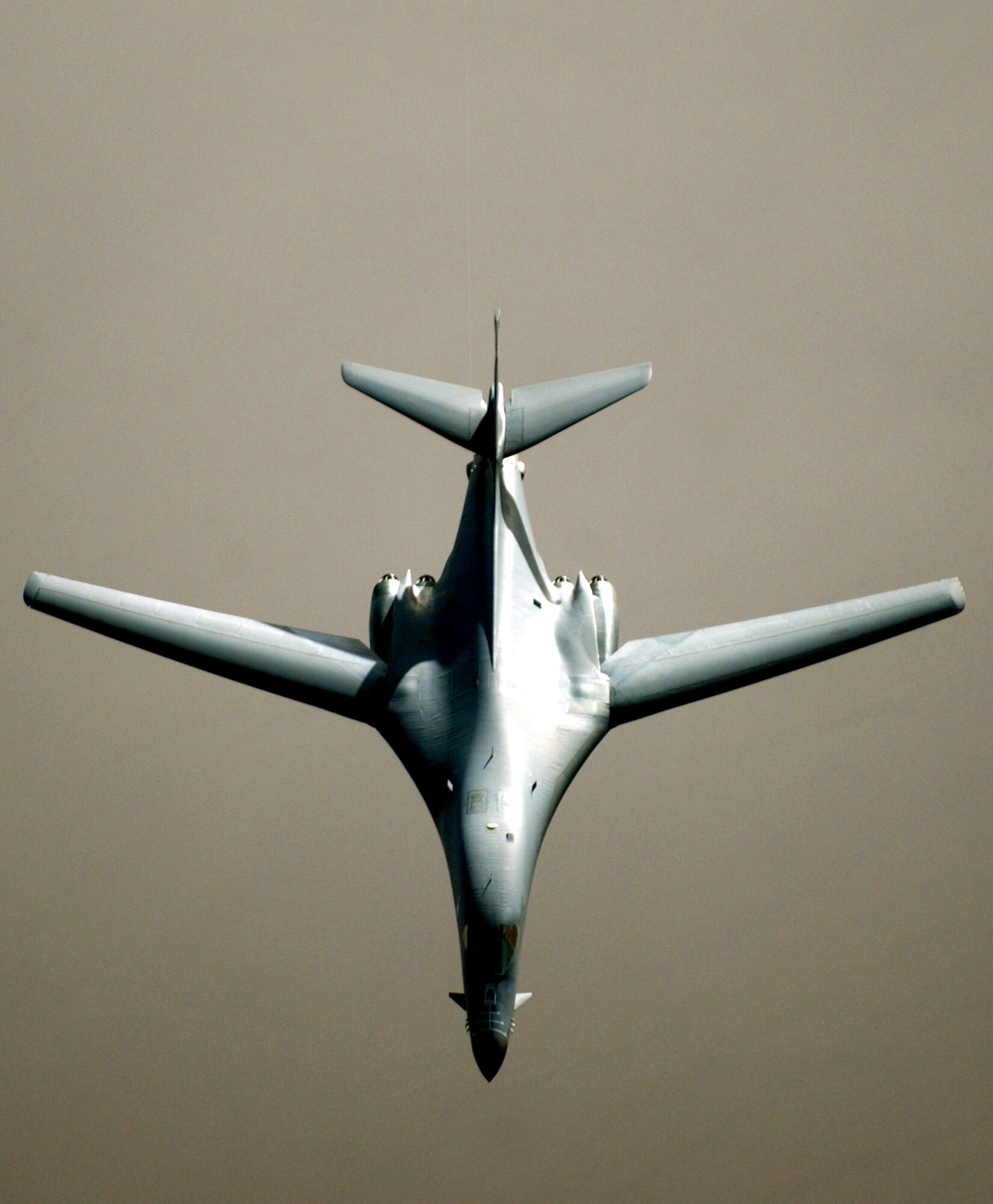 OPERATION IRAQI FREEDOM  --  A B-1 Lancer continues its mission after refueling in the skies near Iraq March 25.   The B-1 crew, assigned to 405 Air Expeditionary Wing, is flying missions from a forward-deployed air base supporting Operation Iraqi Freedom.  (U.S. Air Force photo by Staff Sgt. Cherie A. Thurlby)                         