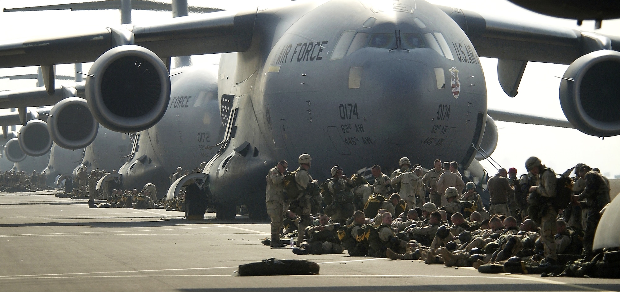 OPERATION IRAQI FREEDOM -- U.S. Army paratroopers prepare to board a C-17 Globemaster III. Nearly 1,000 "Sky Soldiers" of the 173rd Airborne Brigade recently parachuted from C-17s into the Kurdish-controlled area of northern Iraq. This was the first combat insertion of paratroopers using a C-17. U.S. Air Force Tactical Air Controllers along with an Air Force Contingency Response Group were also part of the troop movement in support of Operation Iraqi Freedom. (U.S. Air Force photo by Tech. Sgt. Stephen Faulisi)
