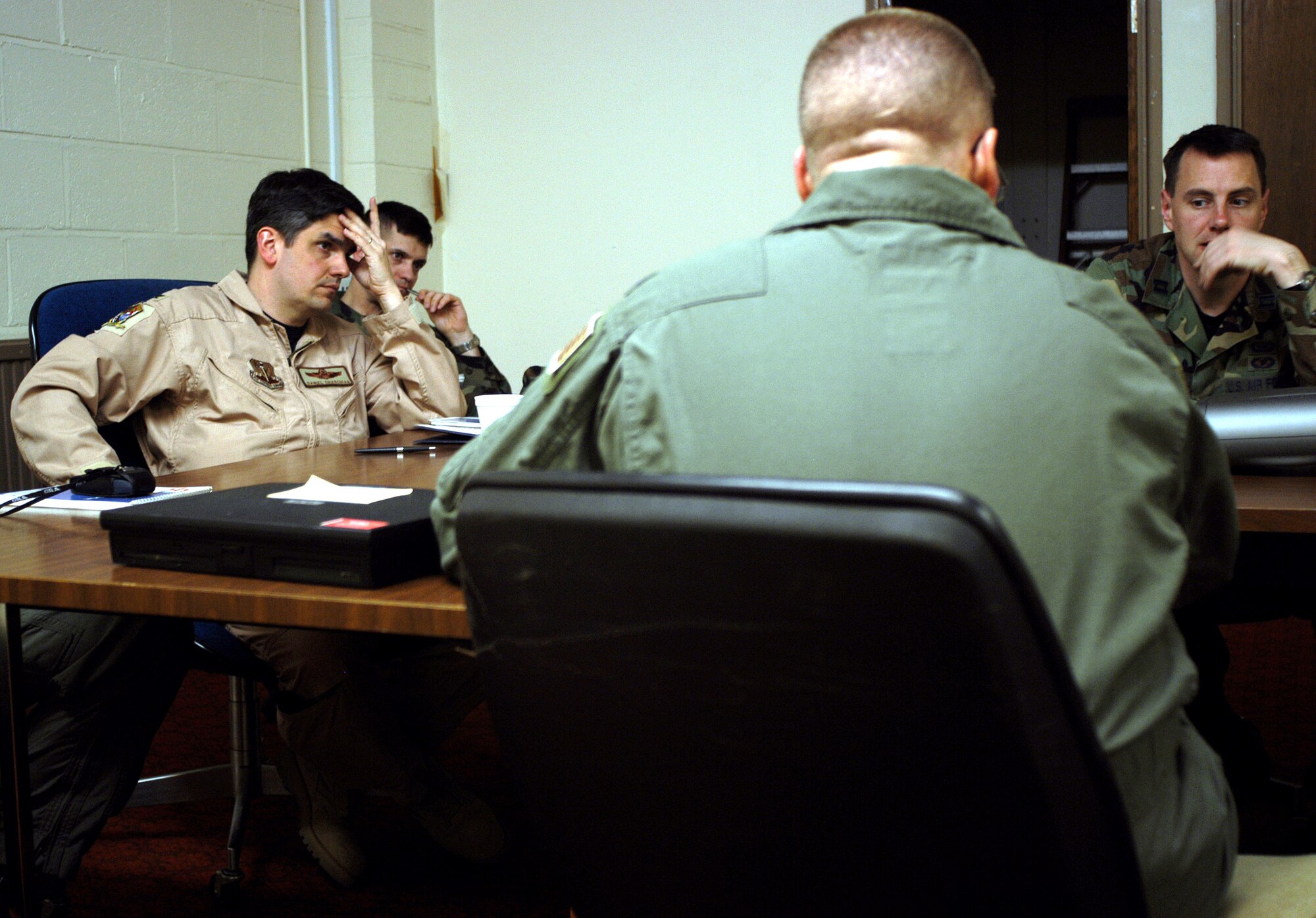 OPERATION IRAQI FREEDOM -- Charchian listens to Lt. Col. Steve talk about a sensitive aircrew issue. (U.S. Air Force photo by Tech. Sgt. Jason Tudor)