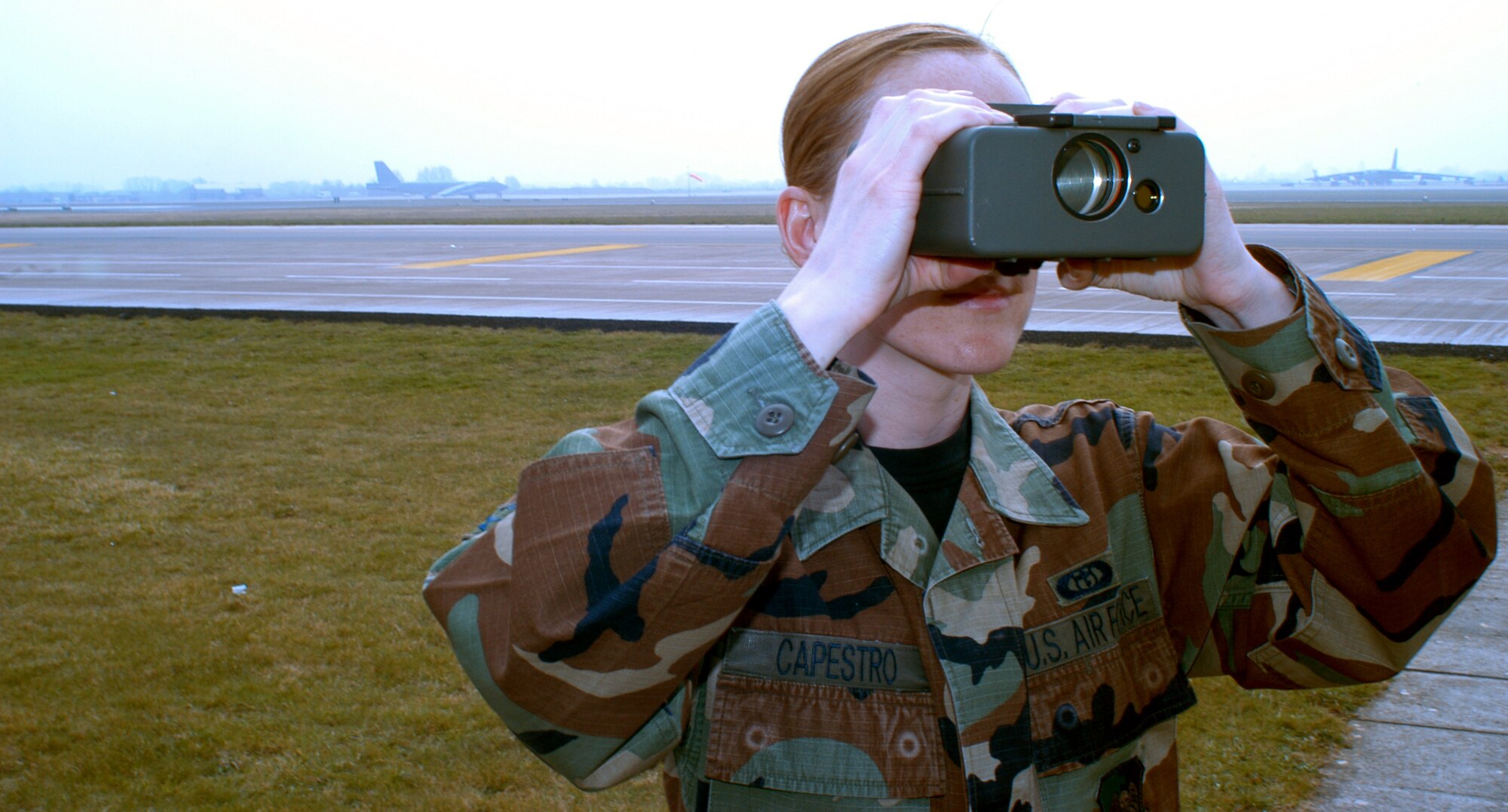 OPERATION IRAQI FREEDOM -- Senior Airman Mellissa Capestro uses a distance-measuring tool to check visibility at a forward-deployed location.  She is a weather forecaster with the 457th Air Expeditionary Group.  (U.S. Air Force photo by Tech. Sgt. Jason Tudor)