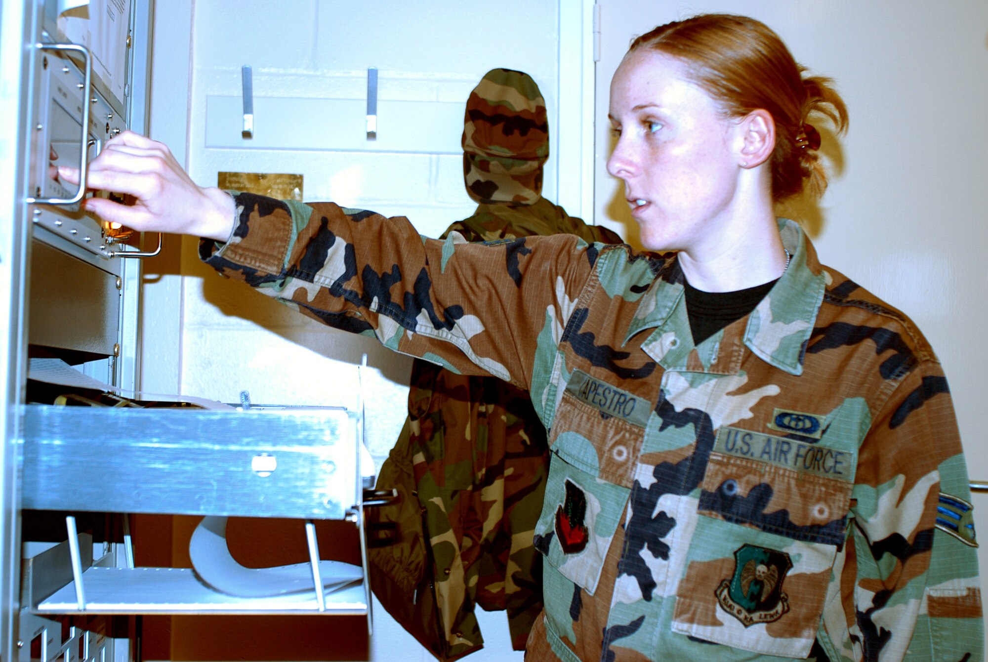 OPERATION IRAQI FREEDOM -- Senior Airman Mellissa Capestro checks cloud height and barometric pressure at a forward-deployed location.  She is a weather forecaster with the 457th Air Expeditionary Group.  (U.S. Air Force photo by Tech. Sgt. Jason Tudor)