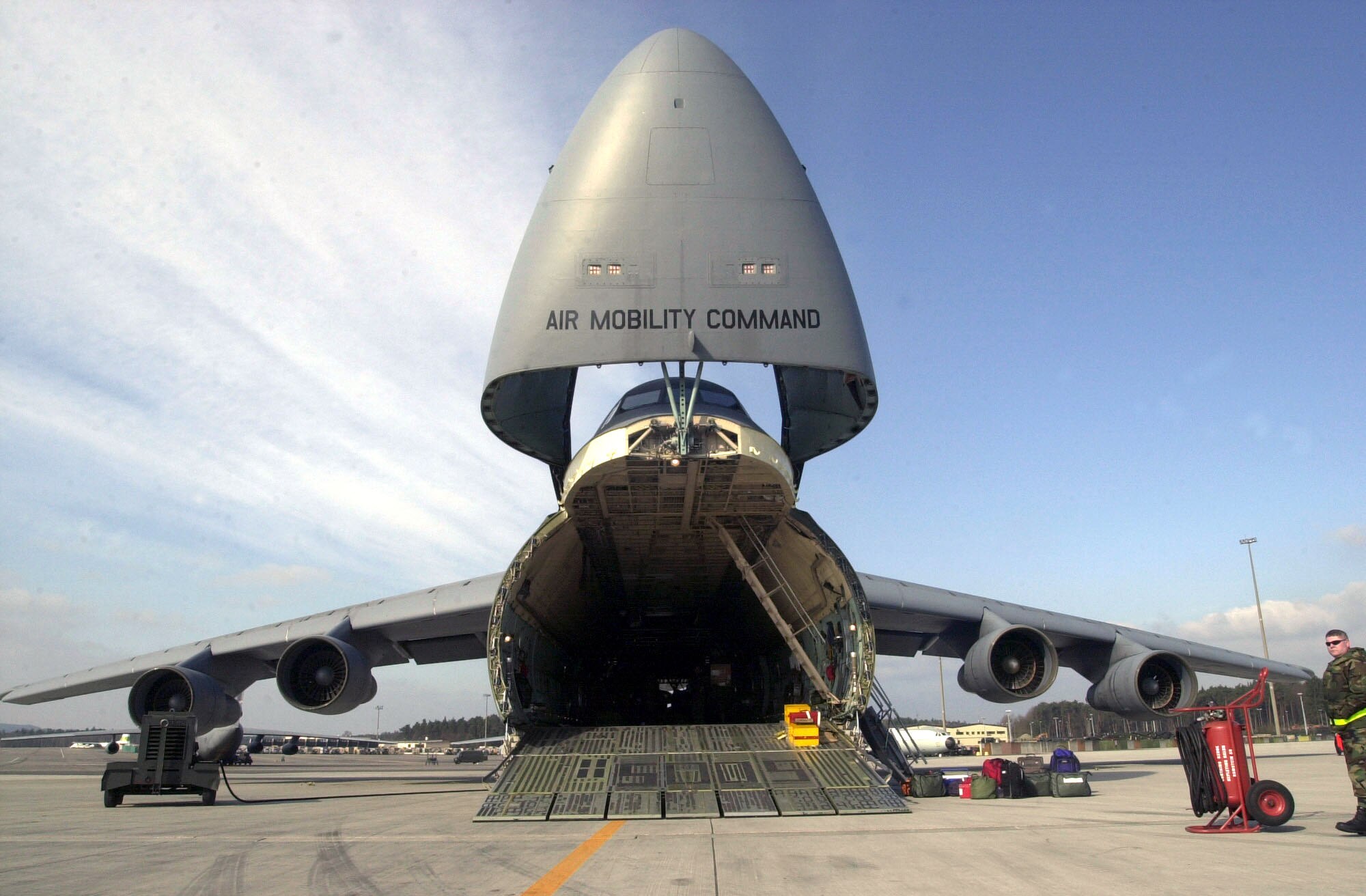 OPERATION IRAQI FREEDOM -- A C-5 Galaxy transport from the 439th Airlift Wing, 337th Air Reserve Squadron, Westover Air Reserve Base, Chicopee, Mass., sits on the ramp at Ramstein Air Base Germany while its crew prepares to upload the day's cargo in support of Operation Iraqi Freedom, March 31, 2003. The C-5 Galaxy is the largest aircraft in the Air Force inventory and is capable of delivering completely-equipped combat units, support forces and all types of supplies to any location in the world. (U.S. Air Force photo by Tech. Sgt. Cherie McNeill) 