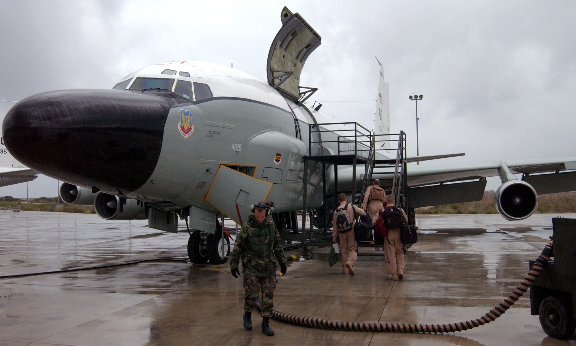 OPERATION IRAQI FREEDOM --  Members of the 398th Air Expeditionary Group prepare an RC-135 Rivet Joint aircraft for a misison at a forward deployed Operation Iraqi Freedom location. (U.S. Air Force photo by Tech. Sgt. Robert J. Horstman)