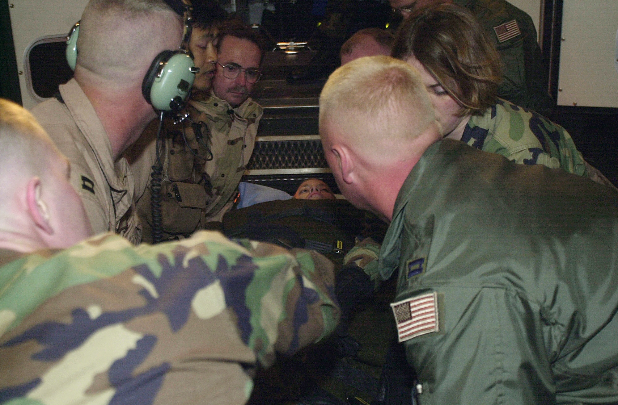 RAMSTEIN AIR BASE, Germany -- Army Pfc. Jessica Lynch is placed into an ambulance after arriving here early April 3.  Air Force pilots and combat controllers played a part in her rescue from Iraqi captors.  (U.S. Air Force photo by Staff Sgt. Felicia Haecker)