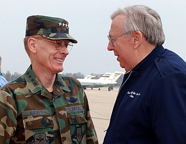 SCOTT AIR FORCE BASE, Ill. -- Gen. John Handy, Commander, U.S. Transportation Command, and Commander, Air Mobility Command, greets Dr. James G. Roche, Secretary of the Air Force, on the flightline April 4.  While here, Roche visited with AMC active duty, Guard and Reserve commanders.  (U.S. Air Force photo by Staff Sgt. Russell J. McBride)
