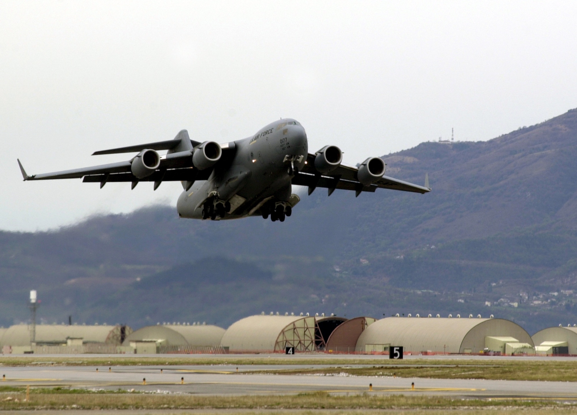 AVIANO AIR BASE, Italy  --  A C-17 Globemaster III takes off from here bound for McChord Air Force Base, Wash., after transiting through Italy.  (U.S. Air Force photo by Staff Sgt. Mitch Fuqua)
