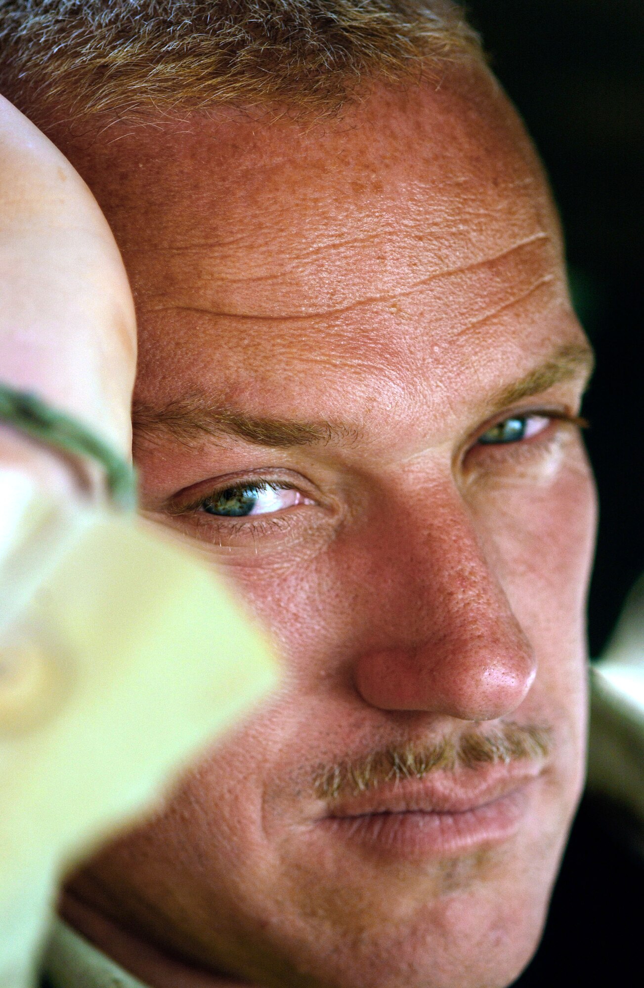 OPERATION IRAQI FREEDOM -- Tech. Sgt. Frank Brown, a security forces craftsman deployed from the 12th Security Forces Squadron, Randolph Air Force Base, Texas to the 363rd Expeditionary Security Forces Squadron, takes break from the heat while performing a perimeter fence line security on April 4, 2003. (U.S. Air Force Photo by Staff Sgt. Matthew Hannen)