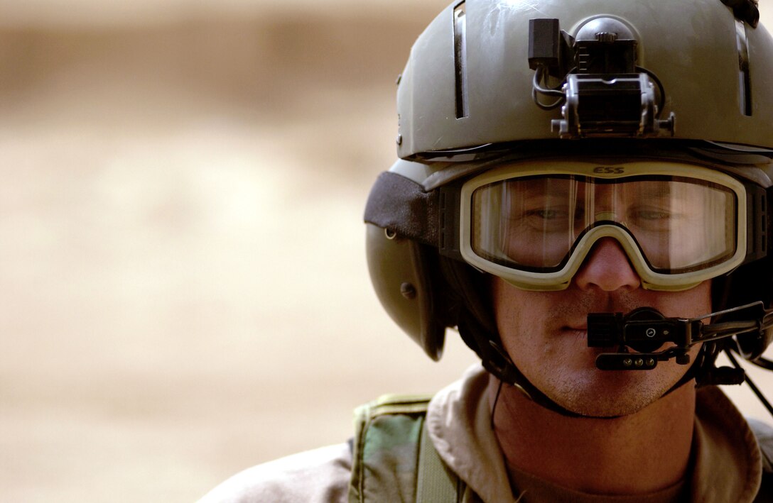 OPERATION IRAQI FREEDOM -- A pararescuemen from the 301st Rescue Squadron talks with a member of the 101st Airborne Division April 6, at a forward deployed location in Iraq during Operation Iraqi Freedom.  (U.S. Air Force photo by Staff Sgt. Shane A. Cuomo) 

