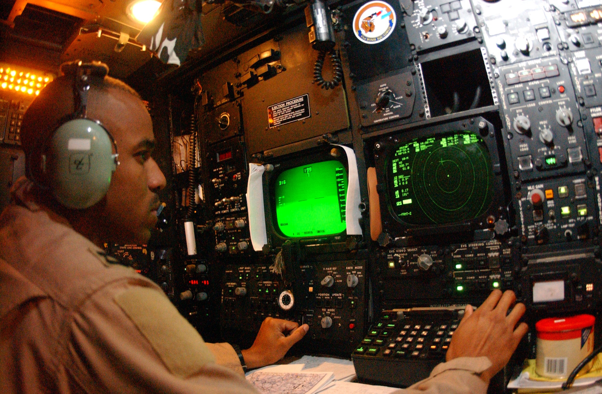 OPERATION IRAQI FREEDOM -- 40th Expeditionary Bomb Squadron, radar navigator adjusts the Electronic Optical Viewing system during a B-52 bombing mission over Iraq on April 7.  Operation Iraqi Freedom is the multi-national coalition effort to liberate the Iraqi people, eliminate Iraqi's weapons of mass destruction and end the regime of Saddam Hussein.  (U.S. Air Force photo by Tech. Sgt. Richard Freeland)