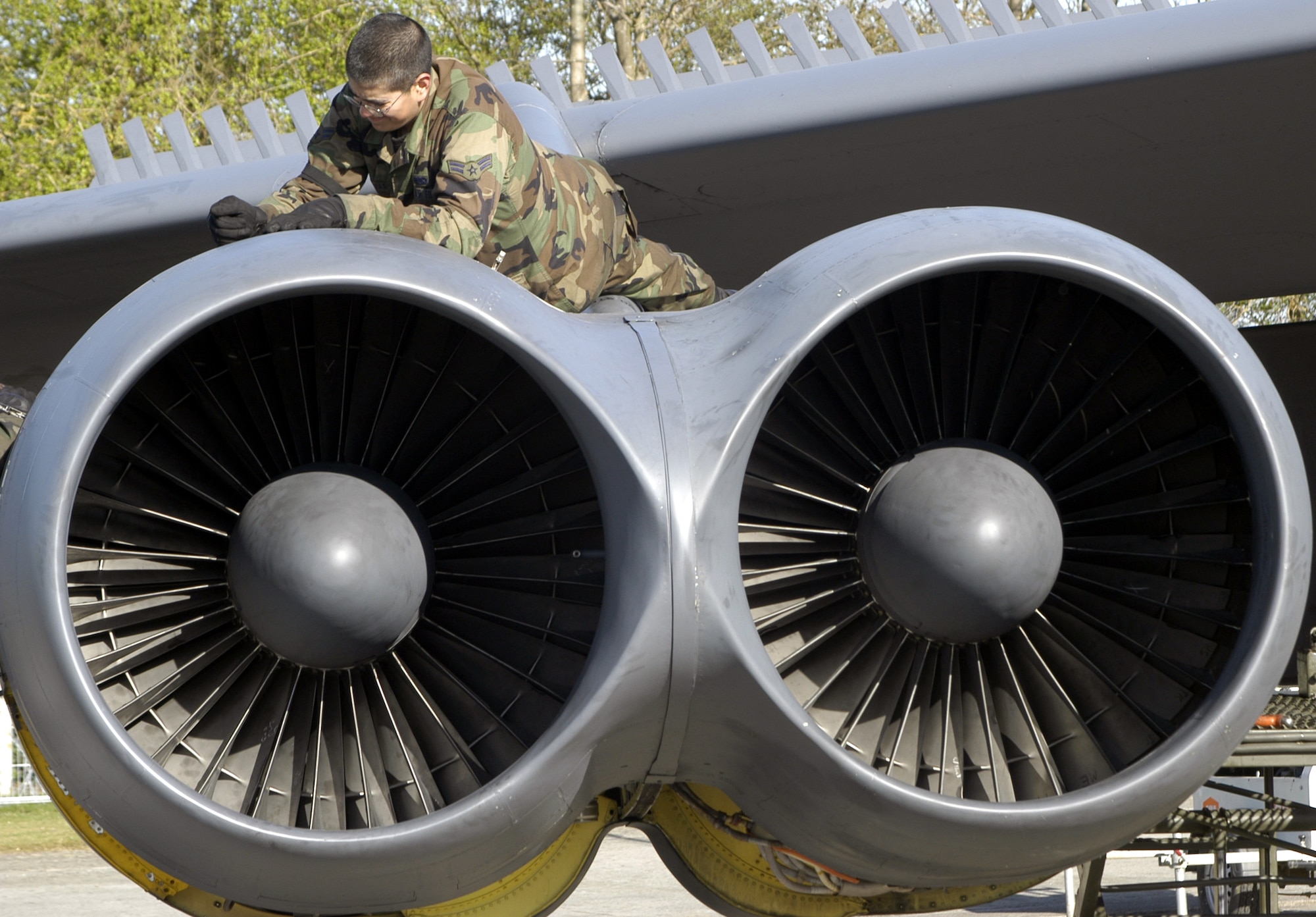 OPERATION IRAQI FREEDOM -- Airman 1st Class Efren Molinar twists a screw out of a B-52 Stratofortress engine cowling April 7 at a forward-deployed location.  Molinar was one of three crew chiefs disassembling the Buff to be washed that day, part of the start of a "contingency phase" maintenance operation that would last three days.  (U.S. Air Force photo by Tech. Sgt. Jason Tudor)