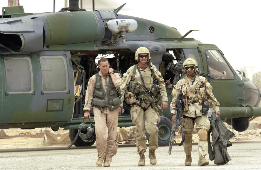 OPERATION IRAQI FREEDOM -- Pararescuemen with the 301st Rescue Squadron return with a downed pilot from a successful rescue mission April 8 at a forward deployed location in southern Iraq during Operation Iraqi Freedom. Operation Iraqi Freedom is multinational coalition effort to liberate the Iraqi people, eliminate Iraq's weapons of mass destruction and bring an end to the regime of Saddam Hussein. (U.S. Air Force photo by Staff Sgt. Shane A. Cuomo)