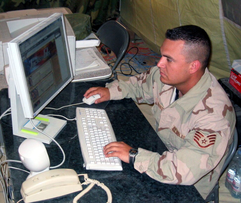 OPERATION IRAQI FREEDOM -- Staff Sgt. Marty Markos, a personnel specialist forward deployed with the 444th Air Expeditionary Group, is one of the nation's first servicemembers to participate in ESPN's "Jock-to-GIs Direct" e-mail pen pal program.  Markos is deployed from Wright-Patterson Air Force Base, Ohio.  His pen pal is Rod Brind'Amour, Carolina Hurricanes center.  (U.S. Air Force photo by Master Sgt. Charles. Ramey)