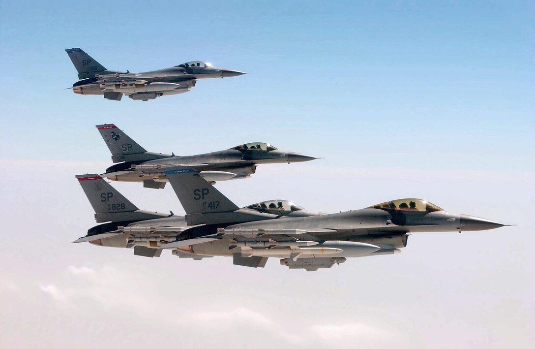 OPERATION IRAQI FREEDOM -- Spangdahlem F-16s fly observation formation off the wing of a KC-10.  KC-10 Extenders from the 305th/514th Air Mobility Wing, McGuire AFB, N.J., are deployed to Burgas Airport and nearby Camp Sarafovo, Bulgaria, to support tanker operations.  Members from various Air Force units world-wide are currently deployed with the 409th AEG in support of Operation Iraqi Freedom.  (U.S. Air Force photo by Master Sgt. Dave Ahlschwede)  