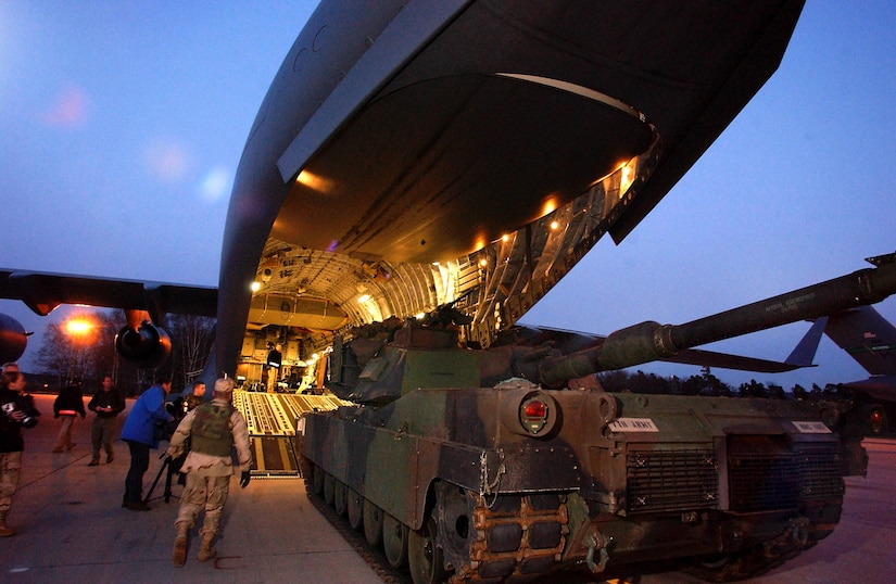 RAMSTEIN AIR BASE, Germany -- Ground crews load a 66 ton Abrams tank onto a C-17 Globemaster III aircraft here. The aircraft, from the 17th Airlift Squadron, Charleston Air Force Base, S.C., delivered the Army's main battle tank to an Operation Iraqi Freedom air base in northern Iraq.  (U.S. Air Force photo by Master Sgt. Keith Reed)