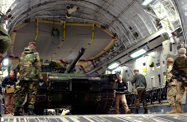 RAMSTEIN AIR BASE, Germany -- Ground crews load a 66 ton Abrams tank onto a C-17 Globemaster III aircraft at Ramstein Air Base, Germany. The aircraft, from the 17th Airlift Squadron, Charleston Air Force Base, S.C., delivered the Army's main battle tank to Bashur Airfield, Iraq.  (U.S. Air Force photo by Master Sgt. Keith Reed)