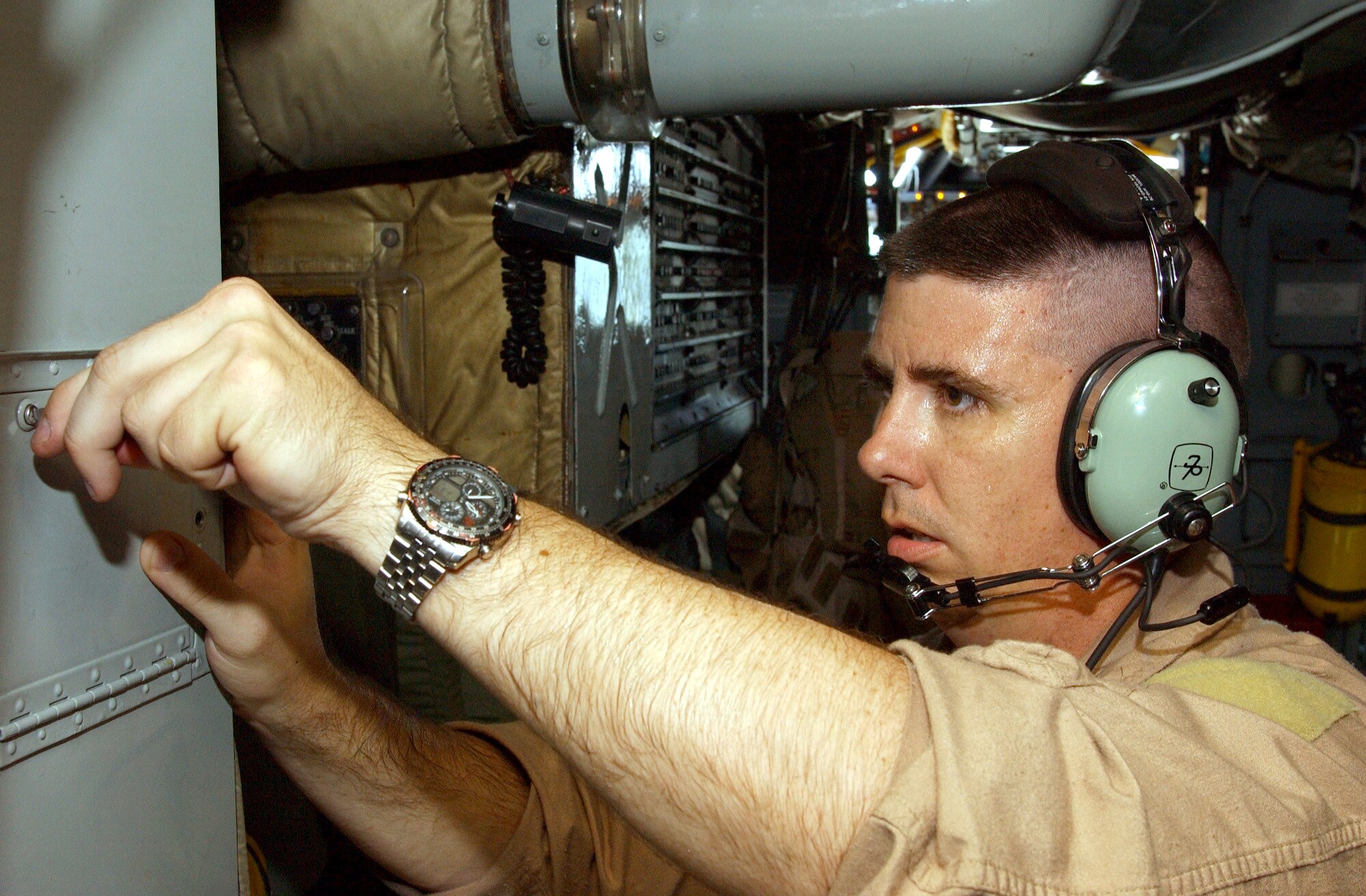 OPERATION IRAQI FREEDOM -- A 40th Expeditionary Bomb Squadron electronic warfare officer secures a data compartment prior to a B-52 bombing mission over Iraq, April 11. Operation Iraqi Freedom is the multinational coalition effort to liberate the Iraqi people, eliminate Iraqi's weapons of mass destruction, and end the regime of Saddam Hussein. (U.S. Air Force photo by Tech. Sgt. Richard Freeland) 