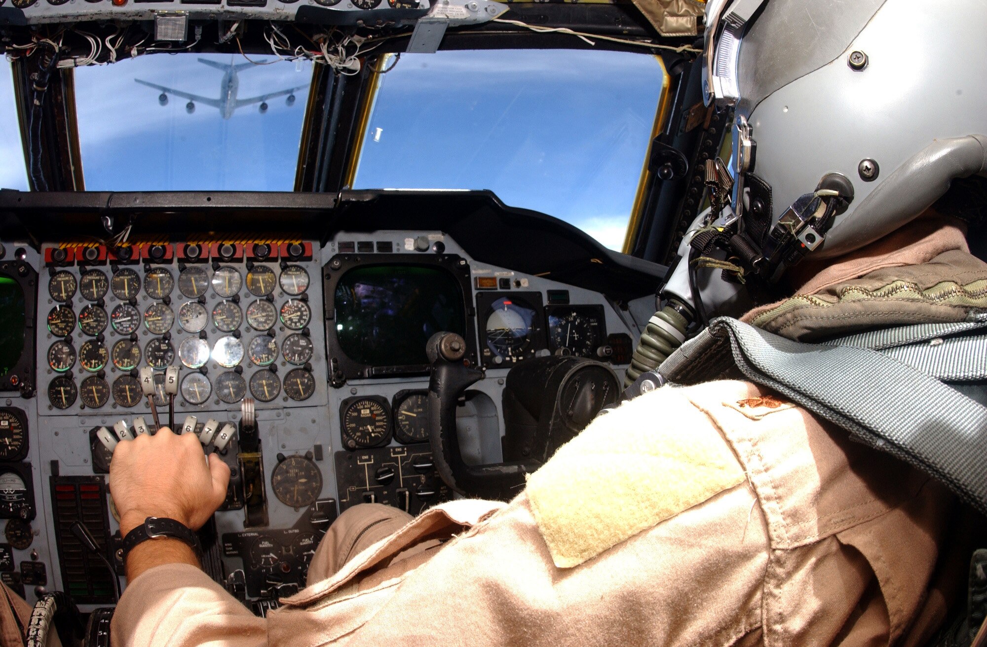 OPERATION IRAQI FREEDOM -- A 40th Expeditionary Bomb Squadron co-pilot carefully guides his B-52 bomber into position behind a KC-135 during an air refueling mission in support of Operation Iraqi Freedom, April 11. Operation Iraqi Freedom is the multinational coalition effort to liberate the Iraqi people, eliminate Iraqi's weapons of mass destruction, and end the regime of Saddam Hussein. (U.S. Air Force photo by Tech. Sgt. Richard Freeland) 