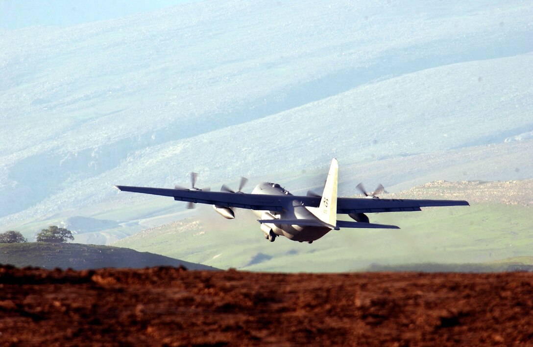 OPERATION IRAQI FREEDOM -- A Ramstein C-130 Hercules takes off from Bashar Airfield in Northern Iraq after landing there to off load supplies to the troops deployed there in support of Operation Iraq Freedoom.  (U.S. Air Force photo by Master Sgt. Keith Reed)