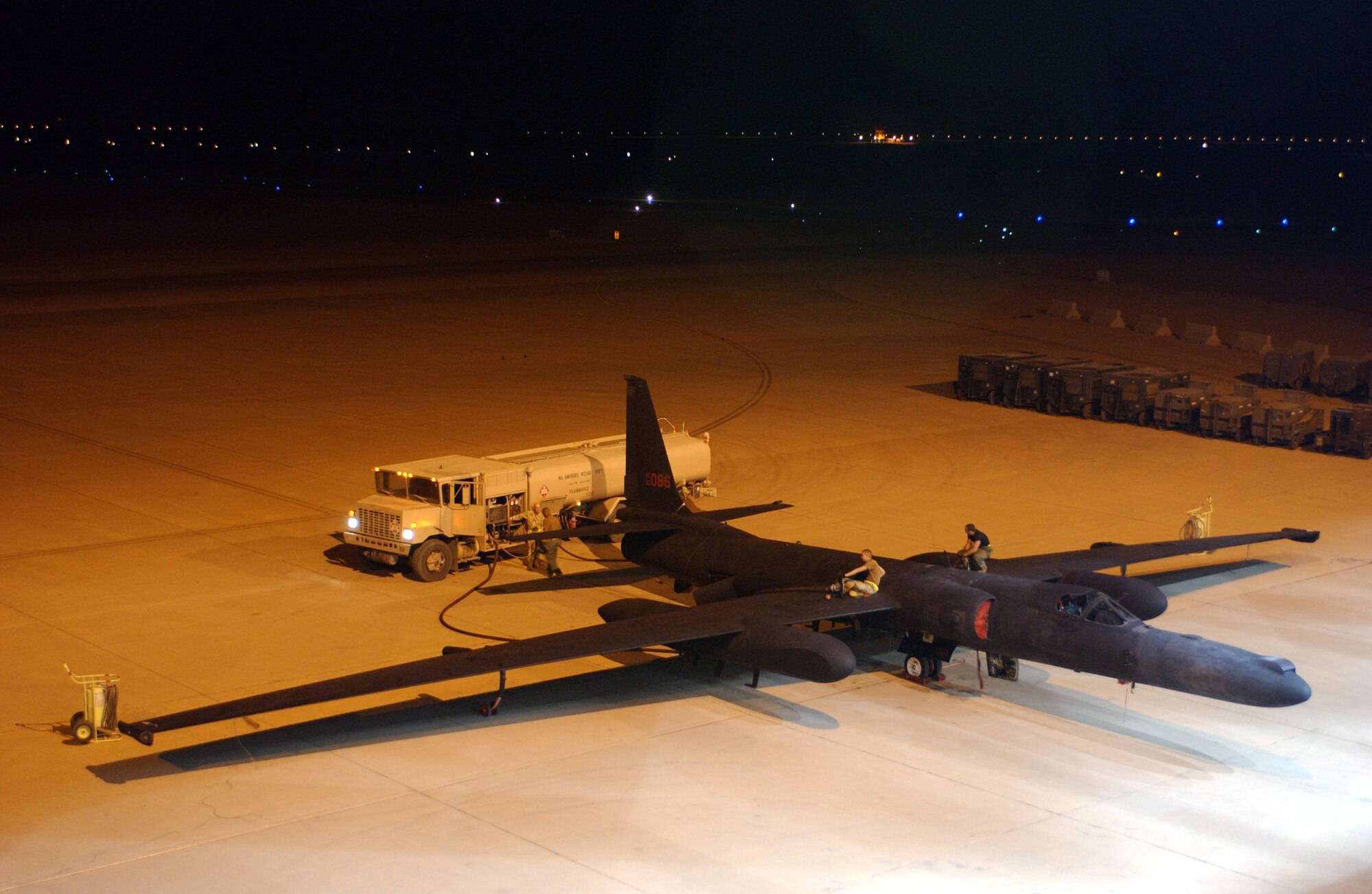 OPERATION IRAQI FREEDOM -- Air Force members deployed from the 9th Aircraft Maintenance Squadron, Beale Air Force Base, Calif., to the 363rd Expeditionary Aircraft Maintenance Squadron, refuel a U-2 Dragon Lady after returning from a mission on April 13.  The U-2 is a high altitude-multi intelligence reconnaissance aircraft.  It can fly above 70,000 ft and provides near-real-time imagery and signals intelligence to war fighters and national authorities in support of Operation Iraqi Freedom at a forward deployed location in Southwest Asia.  (U.S. Air Force photo by Staff Sgt. Matthew Hannen)  