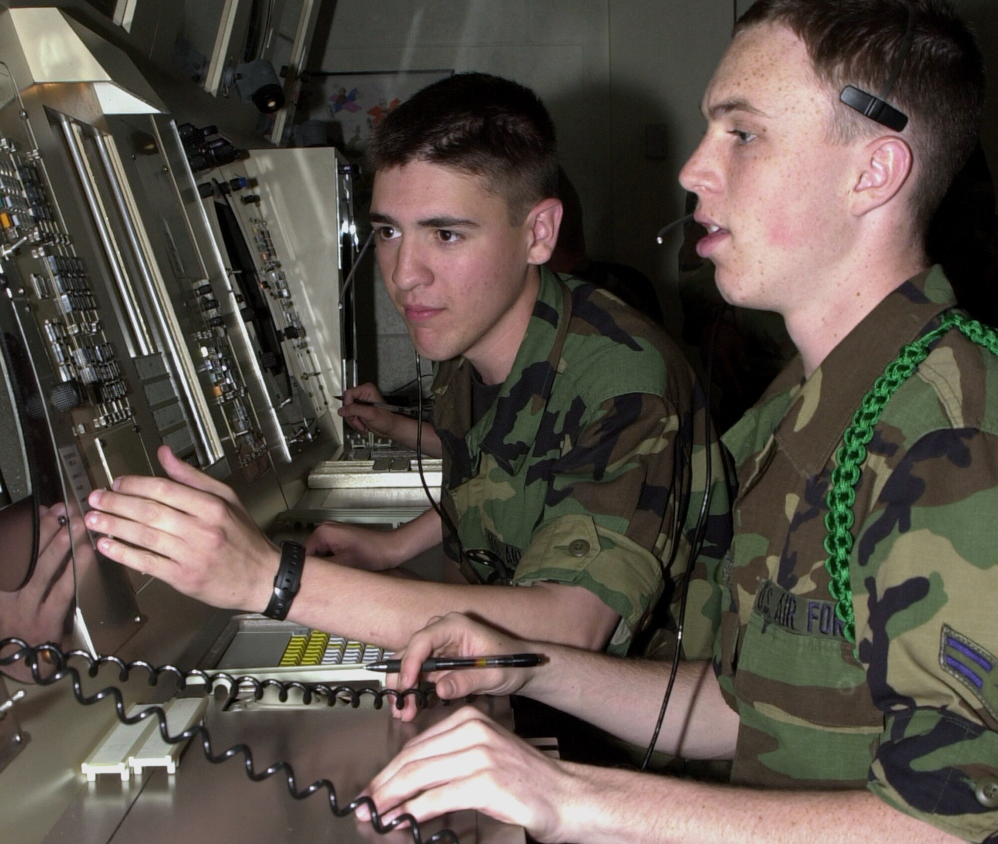 KEESLER AIR FORCE BASE, Miss. -- Airman Basic Nikolas Conors, left, and Airman 1st Class Craig Beatty run through a radar exercise.  The airmen are attending air traffic control school here.  (U.S. Air Force photo by Kemberly Groue)