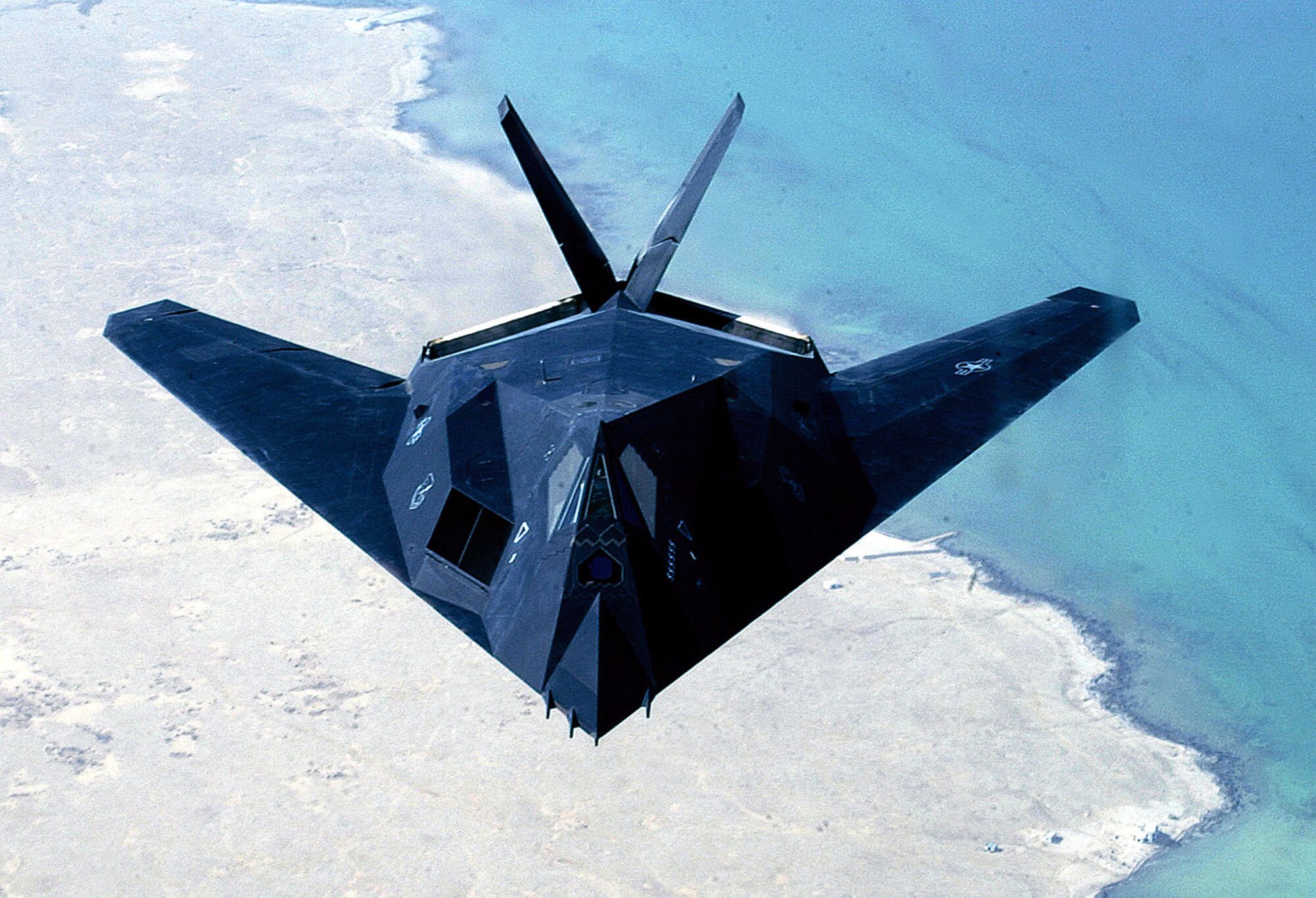 OPERATION IRAQI FREEDOM -- An F-117 from the 8th Expeditionary Fighter Squadron out of Holloman Air Force Base, N.M., flies over the Persian Gulf on April 14, 2003. The 8th EFS has begun returning to Hollomann A.F.B. after having been deployed to the Middle East in support of Operation Iraqi Freedom. (U.S. Air Force photo by Staff Sgt. Derrick C. Goode)
