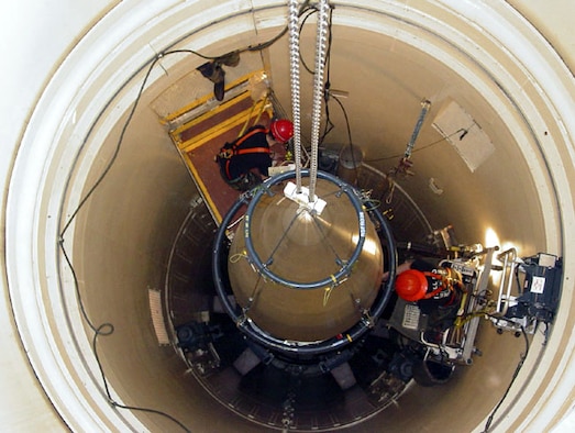 MALMSTROM AIR FORCE BASE, Mont. -- A Malmstrom missile maintenance team removes the upper section of an ICBM at a Montana missile site.  The section was picked at random for a "glory trip," or a test launch, at Vandenberg Air Force Base, Calif., in August.  The launch allows Malmstrom and Vandenberg officials to observe a launch to gather data on the weapon system's performance, accuracy and reliability.  To prepare for the test launch, the missile maintenance team removed the payload shroud, missile guidance set and propulsion system rocket engine.  The booster is coming from Hill AFB, Utah.  The ICBM parts from Malmstrom and the booster from Hill will be reassembled at Vandenberg.  (U.S. Air Force photo by Airman John Parie)