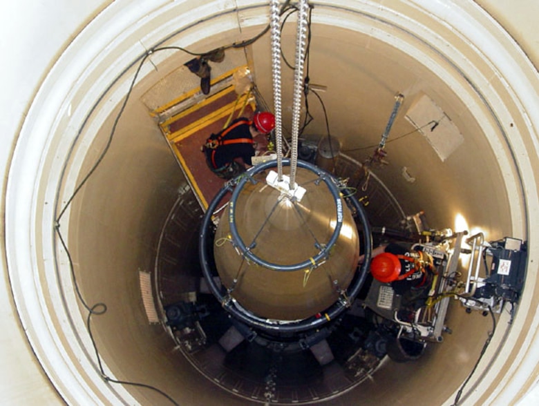 MALMSTROM AIR FORCE BASE, Mont. -- A Malmstrom missile maintenance team removes the upper section of an ICBM at a Montana missile site.  The section was picked at random for a "glory trip," or a test launch, at Vandenberg Air Force Base, Calif., in August.  The launch allows Malmstrom and Vandenberg officials to observe a launch to gather data on the weapon system's performance, accuracy and reliability.  To prepare for the test launch, the missile maintenance team removed the payload shroud, missile guidance set and propulsion system rocket engine.  The booster is coming from Hill AFB, Utah.  The ICBM parts from Malmstrom and the booster from Hill will be reassembled at Vandenberg.  (U.S. Air Force photo by Airman John Parie)