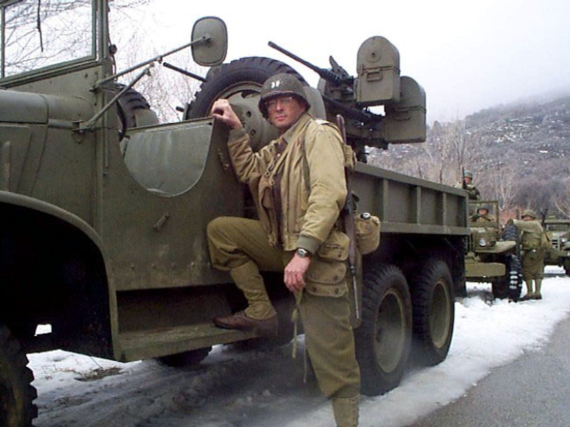 SCHRIEVER AIR FORCE BASE, Colo. (AFPN) -- Maj. Allen Maj. Allen Vickrey stands beside a vintage World War II artillery jeep on the set of "Saints of War."  He plays an Army artillery officer taken as a prisoner of war in the movie scheduled for release this fall.  (Courtesy photo)