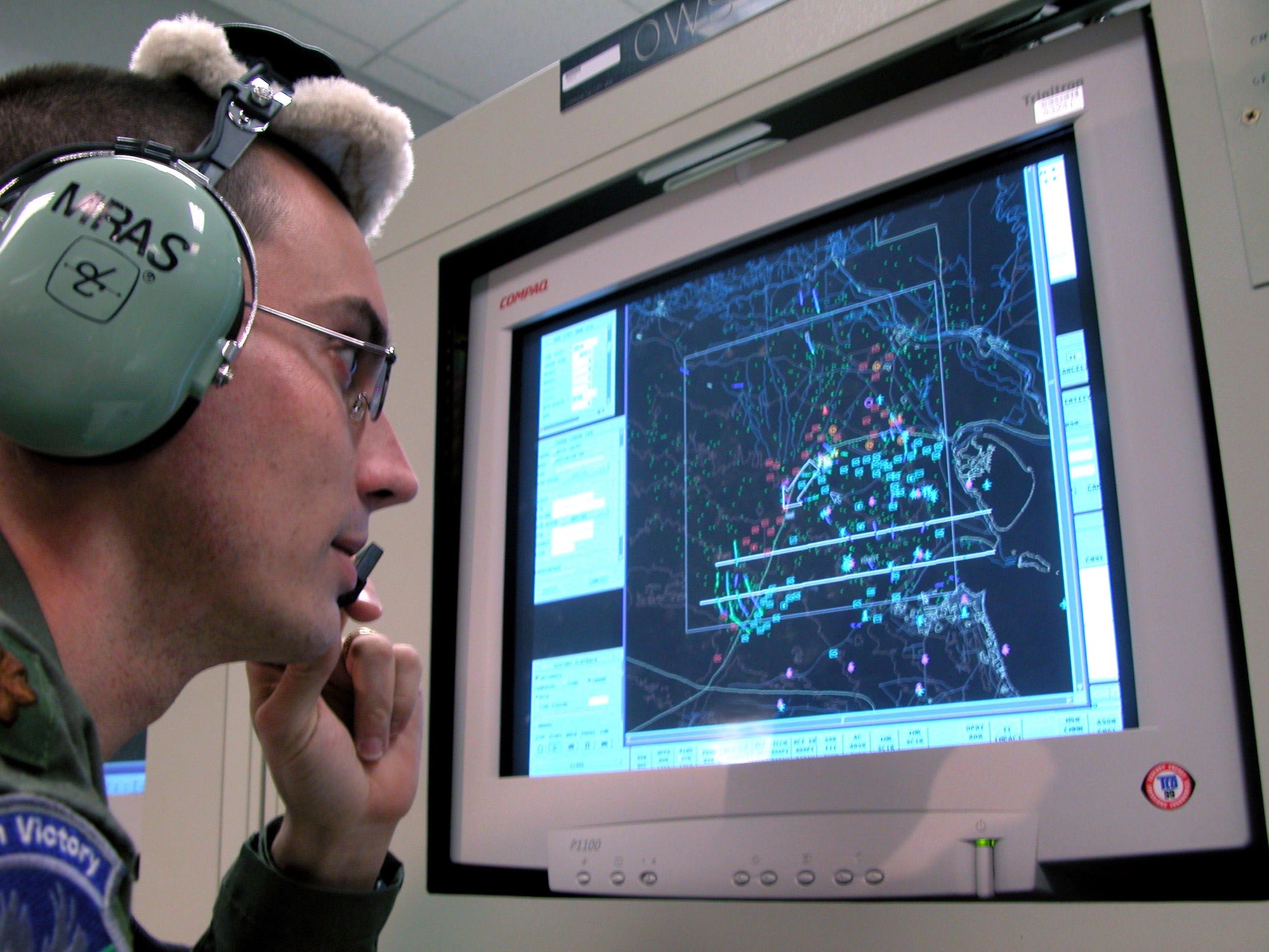 ROBINS AIR FORCE BASE, Ga. (AFPN) -- Maj. Michael Mras, sensor management officer, monitors activity while sitting at an operator workstation.  Mras is one of the many 116th Air Control Wing airmen who detect enemy ground movement and relay the information to forces on the ground and other airborne assets.  (U.S. Air Force photo by Sue Sapp)

