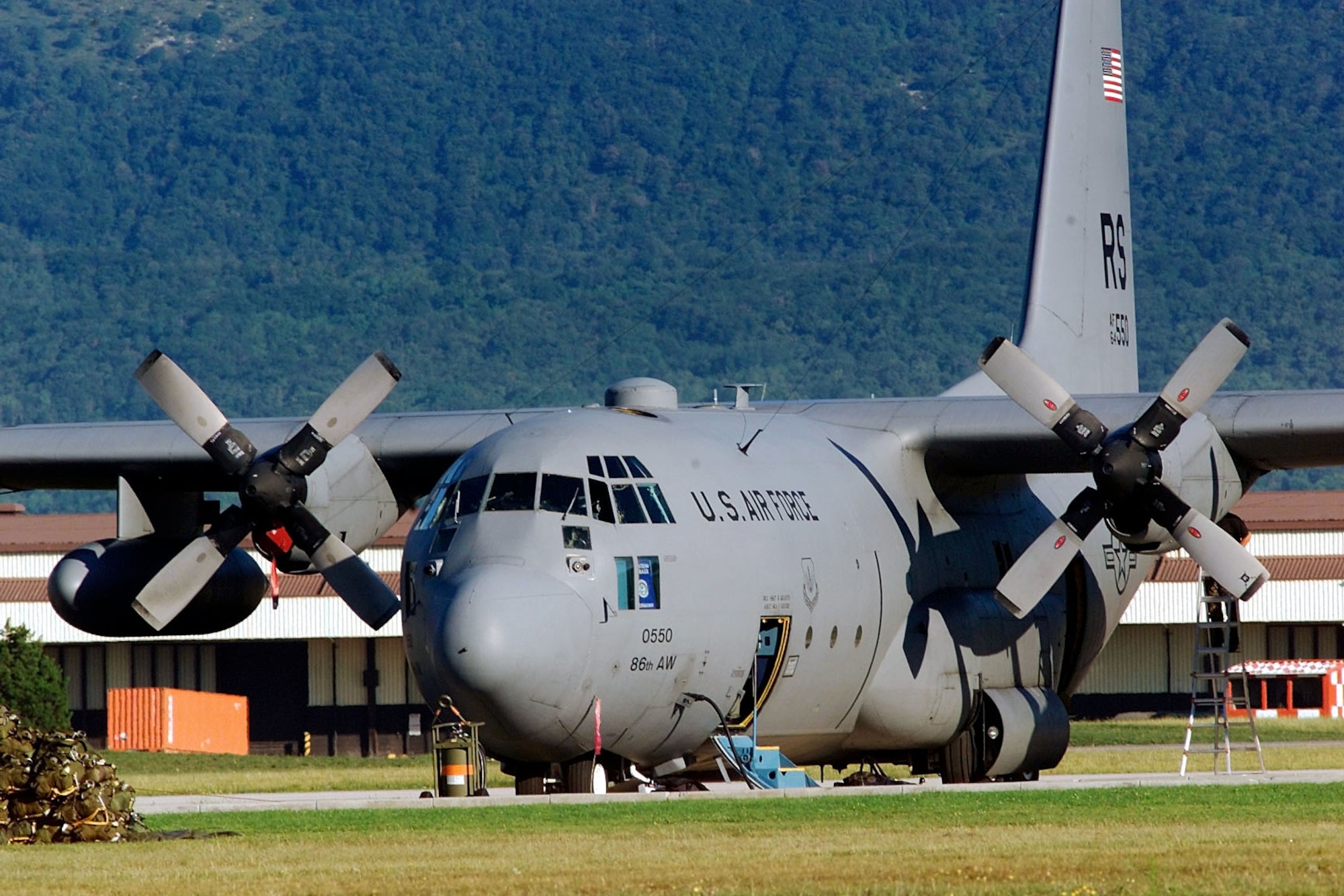 A Ramstein Air Base, Germany, C-130E stands ready at Aviano Air Base, Italy to deliver an Army airborne unit into Bosnia for Rapid Resolve II, a show of force exercise, on July 17, 2000. (U.S. Air Force photo/Senior Airman Aaron D. Allmon II)