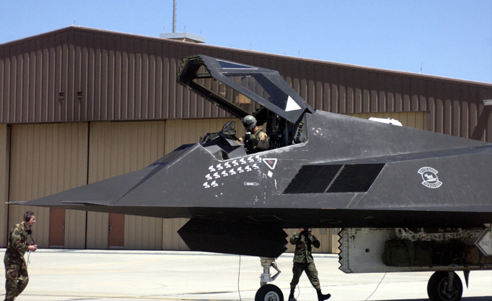 HOLLOMAN AIR FORCE BASE, N.M. (AFPN) -- An F-117 Nighthawk pulls onto the tarmac here April 16, as it returned with four other F-117s from Southwest Asia after supporting Operation Iraqi Freedom. This jet displays 16 combat mission marks showing the number of combat missions it flew during the deployment. (U.S. Air Force photo by Airman 1st Class Vanessa LaBoy)