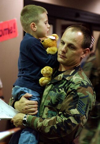 CHARLESTON AIR FORCE BASE, S.C. (AFPN) -- Master Sgt. Steven Foster, a 437th Mission Support Squadron Air Force Aid officer, helps a young family member from Incirlik Air Base, Turkey.   More than 1,300 Air Force family members and nonmission-essential civilian employees from the base arrived at Charleston International Airport, S.C., on March 21. (U.S. Air Force photo by Staff Sgt. Jennie Ivey)