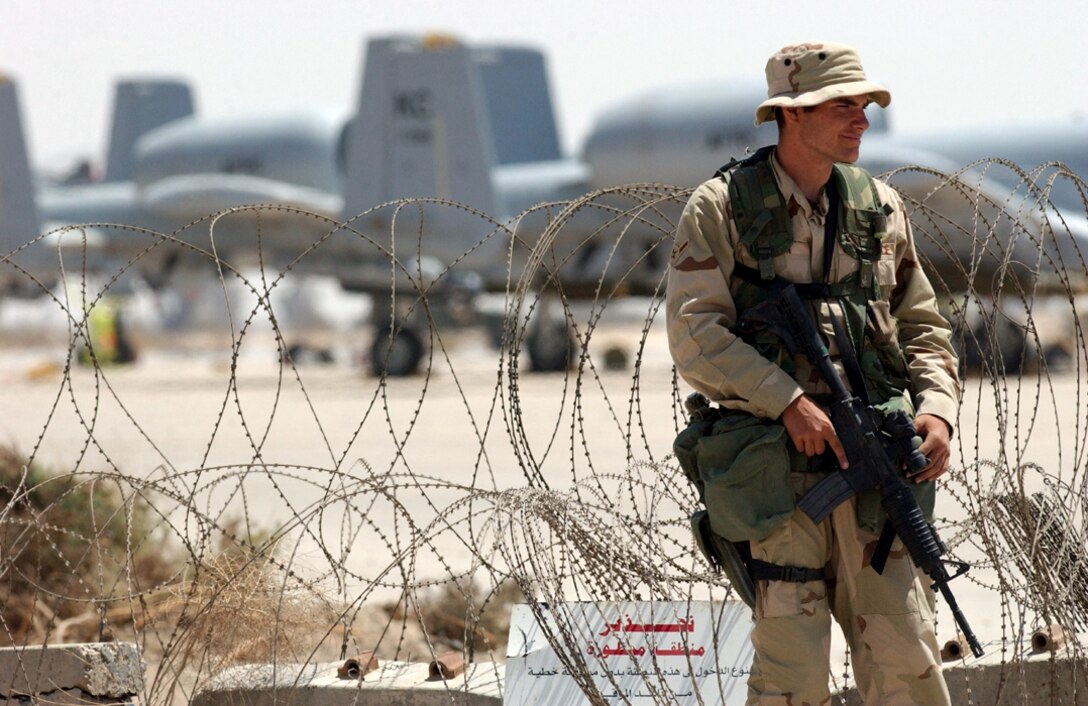 OPERATION IRAQI FREEDOM -- Airman Kellen Grogan of the  407th Expeditionary Security Forces Squadron maintains security at his designated post.  Grogan is deployed to Tallil Air Base in southern Iraq from Moody Air Force Base, Ga., to support Operation Iraqi Freedom.  (U.S. Air Force photo by Master Sgt. Terry L. Blevins)