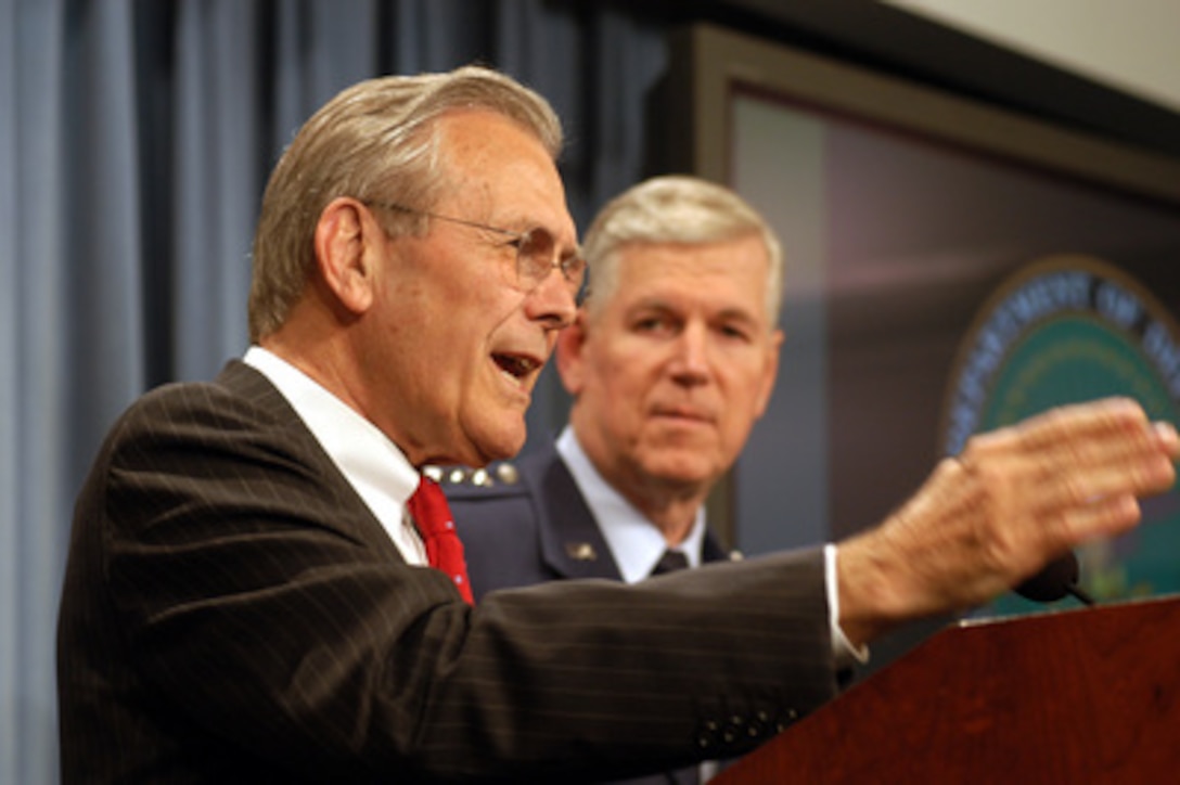 Secretary of Defense Donald H. Rumsfeld gestures to make a point as he answers a reporter's question about the timetable in Iraq during an April 25, 2003, Pentagon press briefing with Chairman of the Joint Chiefs of Staff Gen. Richard B. Myers, U.S. Air Force. Rumsfeld and Myers brought reporters up-to-date on coalition humanitarian operations efforts and remaining pockets of resistance in Iraq. 