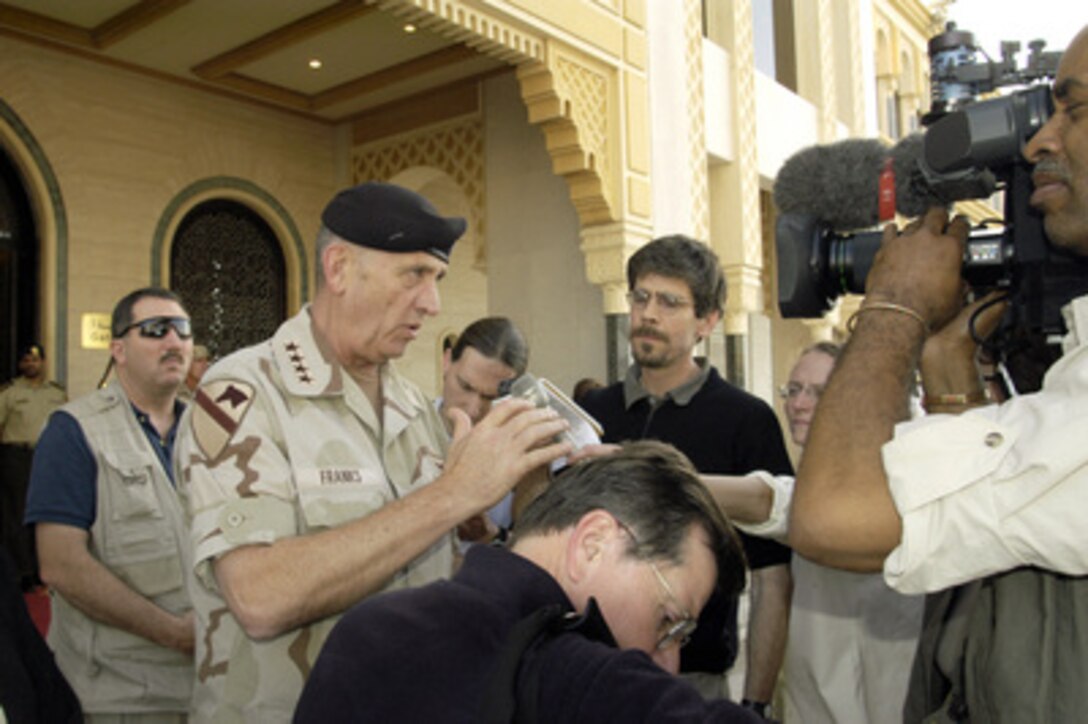 Army Gen. Tommy Franks, commander of U.S. Central Command, speaks with reporters outside a hotel in Abu Dhabi, United Arab Emirates, on April 27, 2003. Franks is accompanying Secretary of Defense Donald H. Rumsfeld during a trip to the Persian Gulf region to visit the troops. 