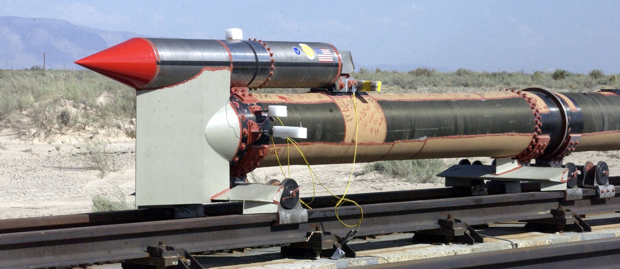 HOLLOMAN AIR FORCE BASE, N.M. (AFPN) -- The 846th Test Squadron here set the world land speed record for a railed vehicle of 6,453 mph, or Mach 8.5, April 30.  The six-second event created a flash as the rocket-propelled sled traveled 16,120 feet.  (U.S. Air Force photo by 2nd Lt. Heather Newcomb)