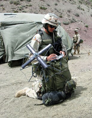 OPERATION ENDURING FREEDOM -- Capt. Danny Stout, an air liaison officer deployed with the Army's 2-505 Parachute Infantry Regiment of the 82nd Airborne Division, talks with F-16 Fighting Falcons flying overhead during a classified mission in the mountains of Afghanistan.  Stout, a B-52 Stratofortress pilot, is serving a two-year tour with the Army, calling in close-air support missions against enemy troops.  (U.S. Air Force photo by Staff Sgt. Russell Wicke)