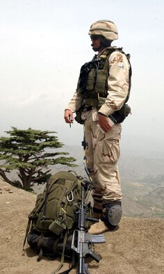OPERATION ENDURING FREEDOM -- Capt. Danny Stout, an air liaison officer deployed with the Army's 2-505 Parachute Infantry Regiment of the 82nd Airborne Division, takes a much-needed break during a classified mission in the mountains of Afghanistan.  Stout, a B-52 Stratofortress pilot serving a two-year tour with the Army, keeps his eyes in the skies for hours at a time to control coalition aircraft on close-air support missions.  (U.S. Air Force photo by 2nd Lt. Rebecca Garland)
