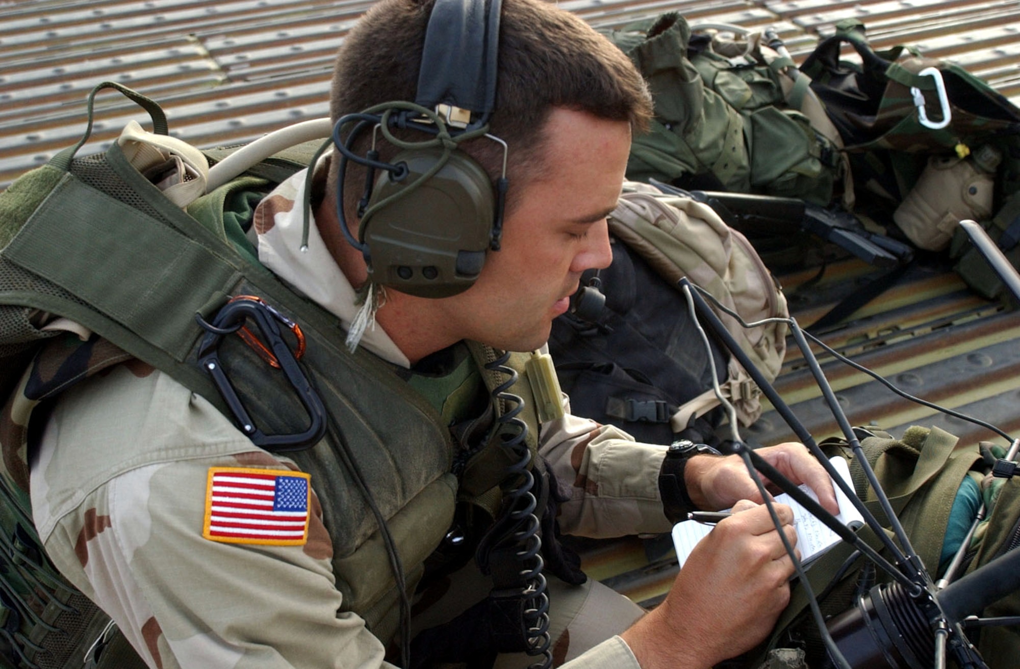 OPERATION ENDURING FREEDOM -- Capt. Danny Stout, an air liaison officer deployed with the Army's 2-505 Parachute Infantry Regiment of the 82nd Airborne Division, tests his radio before taking part in an air assault into a hostile area in the mountains of Afghanistan.  Stout, a B-52 Stratofortress pilot, is serving a two-year tour with the Army, calling in close-air support missions against enemy troops. (U.S. Air Force photo by 2nd Lt. Rebecca Garland)