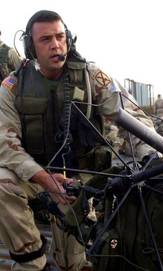 OPERATION ENDURING FREEDOM -- Capt. Danny Stout tests his radio equipment before heading out on a mission to the mountains of Afghanistan with the 2-505 Parachute Infantry Regiment of the 82nd Airborne Division.  Stout, an air liaison officer and B-52 pilot, travels with the Army unit to call in close-air support missions against enemy troops.  (U.S. Air Force photo by 2nd Lt. Rebecca Garland)