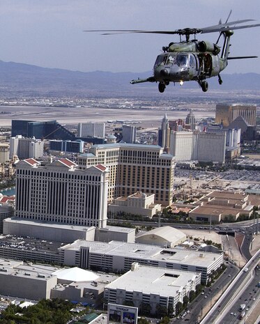 OVER LAS VEGAS -- An HH-60 Pave Hawk from the 66th Rescue Squadron, Nellis Air Force Base, Nevada, flies past the Las Vegas Strip after completing a Combat Search and Rescue training mission.  The 66th RQS is conducting CSAR exercises with the 510th Fighter Squadron, Aviano Air Base, Italy in preparation for the upcoming Red Flag. (U.S. Air Force photo by Tech. Sgt. Robert W. Valenca)